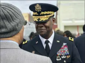  ?? CHRISTINA MYERS — THE ASSOCIATED PRESS ?? In this photo, Brig. Gen. Milford H. Beagle, Jr. commanding general of Fort Jackson, speaks to the president of the Sgt. Isaac Woodard Historical Marker Associatio­n following the dedication ceremony in Batesburg-Leesville, S.C. Beagle, Jr. who now leads the Army’s Fort Jackson in South Carolina is descended from a soldier who served there in a segregated military more than a century ago.