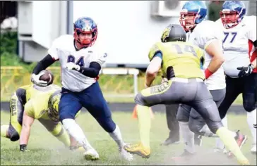  ?? AFP ?? Ukrainian team the Kyiv Rebels, in green, play American football against Estonia’s Titans in a friendly game in Kiev on August 26.