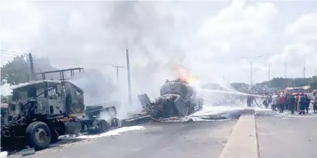  ??  ?? Firefighte­rs trying to put-off fire at the scene of an accident involving petroleum tanker in Gombe on Wednesday. NAN