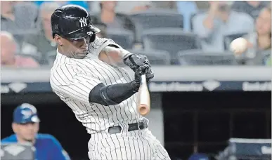  ?? ASSOCIATED PRESS FILE PHOTO ?? In this Sept. 14 photo, New York Yankees' Andrew McCutchen hits a home run in a game against the Toronto Blue Jays.