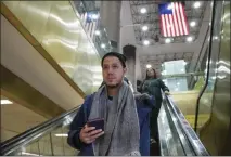  ?? MARK LENNIHAN — THE ASSOCIATED PRESS ?? Mart’n Batalla Vidal takes an escalator into the Port Authority Bus Terminal in New York to take a bus to Washington on Monday. Vidal is a lead plaintiff in one of the cases to preserve the Obama-era program known as Deferred Action for Childhood Arrivals.