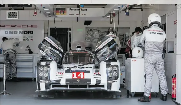  ??  ?? Over the 24 Hours of Le Mans race, both of Porsche’s two 919 gas-electric hybrids — powered by a turbocharg­ed, 500-hp V4 — fail to finish.