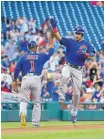  ?? NICK WASS/AP ?? The Cubs’ Willson Contreras, right, celebrates his home run with third base coach Gary Jones (1) as he rounds third during the first inning on Monday.