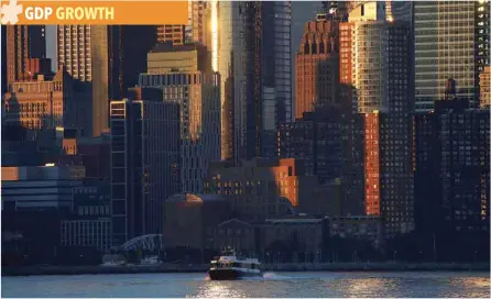  ?? — Reuters ?? A ferry crosses the Hudson River at sunrise in front of lower Manhattan in New York City, as seen from Hoboken, New Jersey.