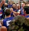  ??  ?? Bulldogs players celebrate victory over the Greater Western Sydney Giants.