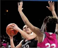  ?? NWA Democrat-Gazette/J.T. WAMPLER ?? Arkansas sophomore guard Chelsea Dungee tries to shoot while Auburn’s Crystal Primm defends Sunday at Walton Arena in Fayettevil­le. Dungee had 41 points in the Razorbacks’ 75-72 loss to the Tigers.
