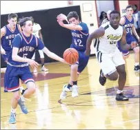  ?? Photo by Ernest A. Brown ?? Mount St. Charles guard Tommy Burke (5) takes a steal for a hoop during the first half of Mount’s overtime win over St. Pat’s.