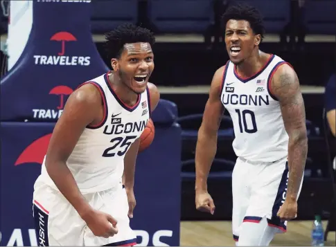  ?? David Butler II / Associated Press ?? UConn forward Josh Carlton (25) reacts after scoring against DePaul during the first half on Dec. 30 in Storrs.