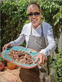  ?? HOUGHTON MIFFLIN HARCOURT/RUX MARTIN BOOKS ?? Chef Eddie Hernandez, executive chef of Atlanta-based Taqueria del Sol, is one of the authors of “Turnip Greens & Tortillas.”