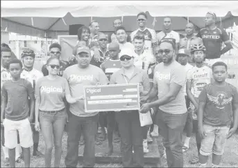  ?? (Orlando Charles photo) ?? The top prize winners along with representa­tives of Digicel and the Guyana Cancer Institute pose for a photo opportunit­y yesterday following the seventh Digicel Cycling event staged on the circuit outside the GDF compound on Irving Street and Vlissingen Road.