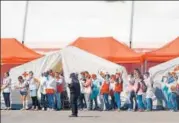  ?? AFP ?? Red Cross members celebrate as the Aquarius rescue ship enters the port of Valencia on Sunday.