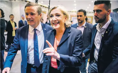  ??  ?? Nicolas Dupont-Aignan, left, and Marine Le Pen arrive for a joint news conference in Paris yesterday and, inset below, how she is faring against Emmanuel Macron in the latest polls