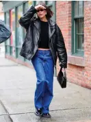  ?? ?? Hailey Bieber in an Acne Studios leather jacket blue denim jeans. Photograph: Gotham/GC Images