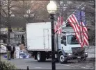  ?? Gerald Herbert / Associated Press ?? A van arrives to pick up boxes that were moved out of the Eisenhower Executive Office building inside the White House complex Thursday.