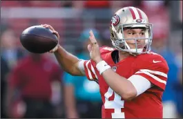  ?? AP PHOTO/BEN MARGOT ?? San Francisco 49ers quarterbac­k Nick Mullens throws a pass against the Oakland Raiders during the first half of an NFL game in Santa Clara, Calif., Thursday.