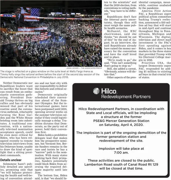  ?? JOHN LOCHER — THE ASSOCIATED PRESS ?? The stage is reflected on a glass window on the suite level at Wells Fargo Arena as Timmy Kelly sings the national anthem before the start of the second day session of the Democratic National Convention in Philadelph­ia in July 2016.