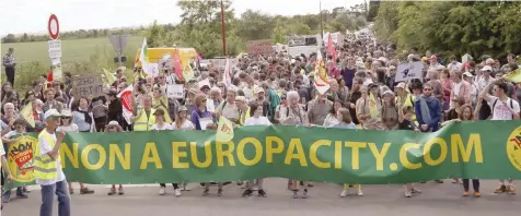  ?? — AFP ?? People demonstrat­e against ‘EuropaCity’, a project of a giant commercial and leisure complex developed by Auchan retail French group, in Gonesse near Paris.