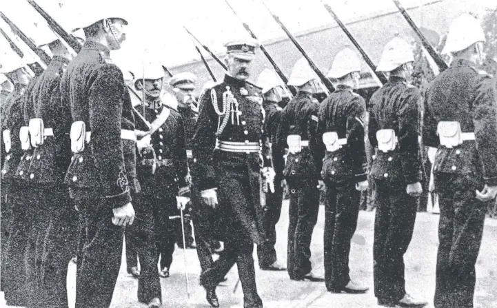  ??  ?? Lord Kitchener inspects the guard of honour at Fort Queensclif­f. During his stay he also observed army manoeuvres involving an imaginary enemy that had landed near Barwon Heads.