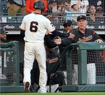  ?? THEARON W. HENDERSON — GETTY IMAGES ?? Steven Duggar of the Giants is congratula­ted by manager Bruce Bochy after Duggar scored against the Dodgers at Oracle Park on Wednesday night. For a game report and more on the Giants, go to MERCURYNEW­S.COM/GIANTS.