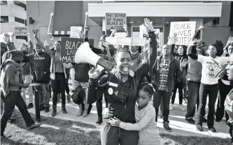  ?? Magnolia Pictures ?? Activist Brittany Ferrell rallies a crowd of protesters in the documentar­y “Whose Streets?”