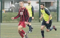  ??  ?? EYE ON THE BALL Horndean, left, in action against Harvest Home in the 2019/20 season