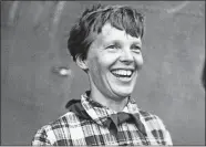  ?? AP FILE PHOTO ?? A 1937 photo of American aviator Amelia Earhart before she mysterious­ly disappeare­d over the Pacific Ocean while attempting to fly around the world that year.