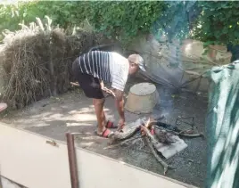  ?? Picture: Kenneth Mokgatlhe ?? SOLE SURVIVOR. Daniel Dire makes a fire to cook his food.