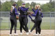  ?? JEN FORBUS — THE MORNING JOURNAL ?? The Keystone infield celebrates a strikeout from pitcher Sydney Campbell, center. Campbell has hurled two perfect games this season.