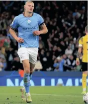  ?? LINDSEY PARNABY ?? MANCHESTER City’s Norwegian striker Erling Haaland after scoring the second goal during the UEFA Champions League group G football match against Borussia Dortmund. | AFP