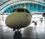  ?? Ali Mohammadi / Bloomberg ?? A new twin engine ATR 72-600 turboprop aircraft sits in a hangar following its arrival at Mehrabad Internatio­nal airport in Tehran, Iran, on Aug. 5.