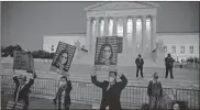  ?? Samuel Corum/getty Images North America/tns ?? People that both support and oppose the nomination of Judge Amy Coney Barrett demonstrat­e in front of the Supreme Court of the United States in Washington, D.C.