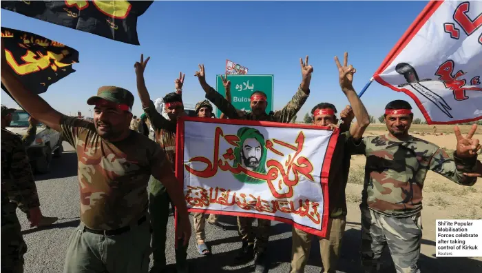  ??  ?? Shi’ite Popular Mobilisati­on Forces celebrate after taking control of Kirkuk Reuters