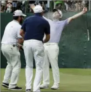  ?? THEMBA HADEBE — THE ASSOCIATED PRESS ?? South Africa’s Brandon Grace, right, is sprayed with champagne as he celebrates winning the Nedbank Golf Challenge at Sun City, South Africa, Sunday.