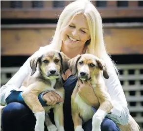  ?? MARK VAN MANEN/PNG ?? Eva Sereda went to Costa Rica and came back with three puppies. She kept these two and gave the third to a relative.