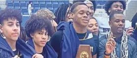  ?? RICK CANTU/AMERICAN-STATESMAN ?? Stony Point players Junior Goodlet, Uzziah Buntyn and Josiah Moseley along with head coach Antoine Thompson celebrate the Tigers' Region IV-6A championsh­ip Saturday over San Antonio O'Connor. The Tigers along with Class 2A Thrall will represent the Austin area at this week's UIL state tournament.