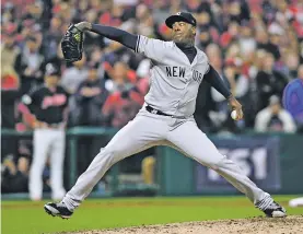  ?? PHOTOS BY DAVID DERMER/THE ASSOCIATED PRESS ?? New York Yankees closer Aroldis Chapman, who faced Cleveland in last year’s World Series and signed an $86 million free agent contract in December, worked two innings for the save.