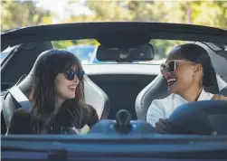  ??  ?? Dakota Johnson (left) plays an ambitious personal assistant to a legendary diva portrayed by Tracee Ellis Ross in “The High Note.”