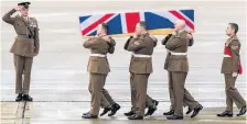  ??  ?? FULL MILITARY HONOURS
Brodie’s coffin is carried by comrades