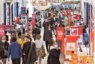  ??  ?? Customers shop at Macy’s department store in New York on Black Friday. The coronaviru­s pandemic is clouding Black Friday much as it has overshadow­ed 2020 in general. — AFP