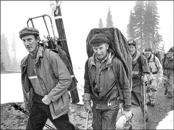  ?? Barry Wong The Associated Press ?? A search team led by Lou Whittaker, left, starts its ascent of Mount Rainier, the tallest peak in Washington state, in 1981. The legendary mountainee­r has died at age 95.