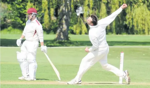  ??  ?? Tom Drake bowling during his spell of 4-29 for Frocester against Biddestone