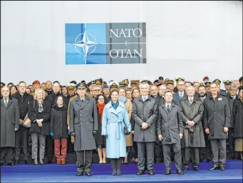  ?? Geert Vanden Wijngaert The Associated Press ?? NATO Secretary General Jens Stoltenber­g, front center, welcomes Sweden into the fold in Brussels, Belgium, on Monday with Sweden’s Prime Minister Ulf Kristersso­n, center right, and Sweden’s Crown Princess Victoria, center left, on hand.