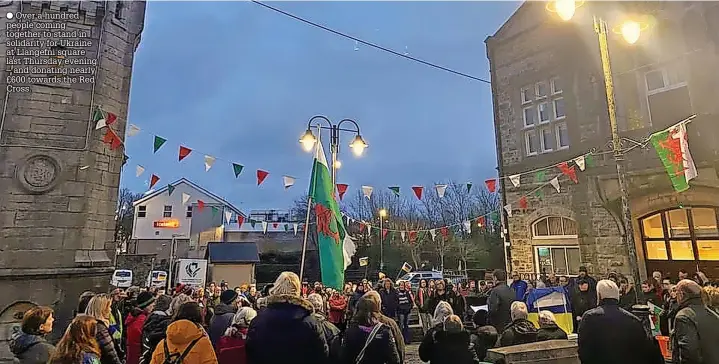  ?? ?? Over a hundred people coming together to stand in solidarity for Ukraine at Llangefni square last Thursday evening – and donating nearly £600 towards the Red Cross.