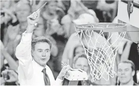  ?? RICHARD MACKSON-USA TODAY SPORTS ?? Coach Rick Pitino celebrated after Louisville earned the 2013 national title with an 82-76 win against Michigan.