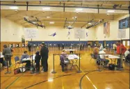  ??  ?? Torrington residents wait to cast their votes in the municipal election on Tuesday.