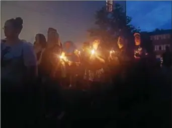  ?? DIGITAL FIRST MEDIA FILE PHOTO ?? Supporters of slain teenager Bianca Roberson met in the backyard of her home during a vigil on June 30.