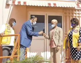  ??  ?? CHASE Fund CEO Wilford Heaven (second left) hands over a key to the new lab to regional pathologis­t Dr Colette Hal, while president of the Lions Club of Mandeville, Wendy Coley- Haynes (right) and chairman of the lab project, Dr Hopeton Falconer look on.