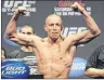  ?? CP PHOTO ?? Fighter Georges St-Pierre flexes during the weight-in for UFC 158 in Montreal in March 2013.