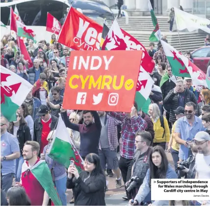  ?? James Davies ?? > Supporters of Independen­ce for Wales marching through Cardiff city centre in May
