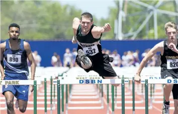  ?? JULIE JOCSAK/STANDARD STAFF ?? Danial Burlak of St. Michael High School competes in the junior mens shot put during the SOSSA Track and Field meet at the Niagara Olympic Club on Thursday.